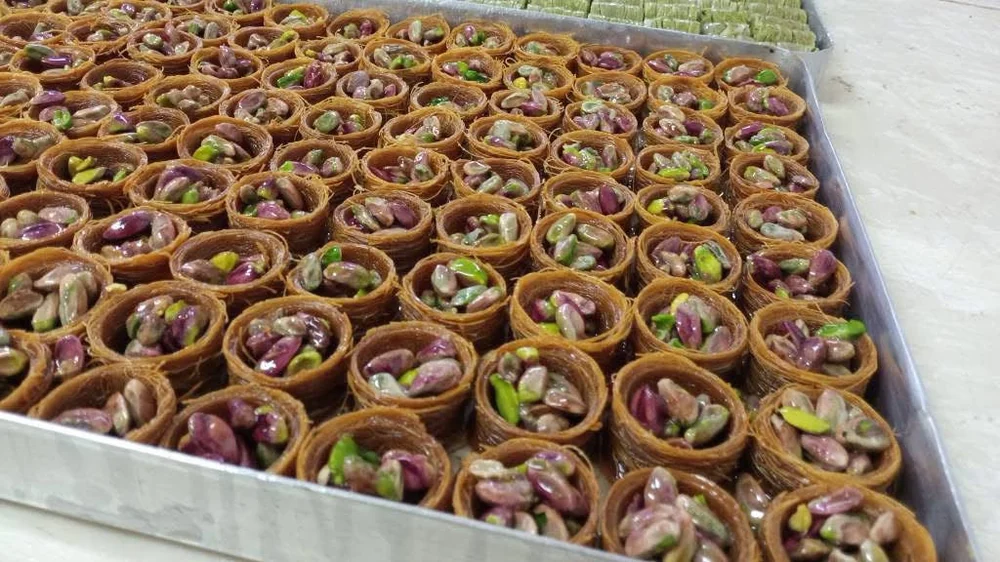 Pistachio baklava cups arranged on a tray
